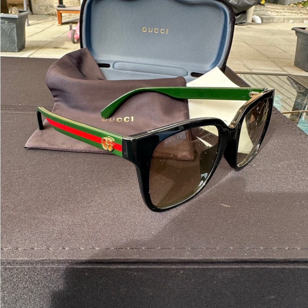 Gucci Sunglasses with Black Frame and Green Accents